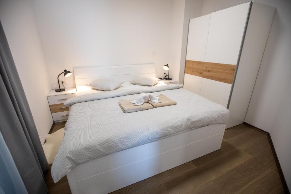 Postel nebo postele na pokoji v ubytování Apartmani Jančić