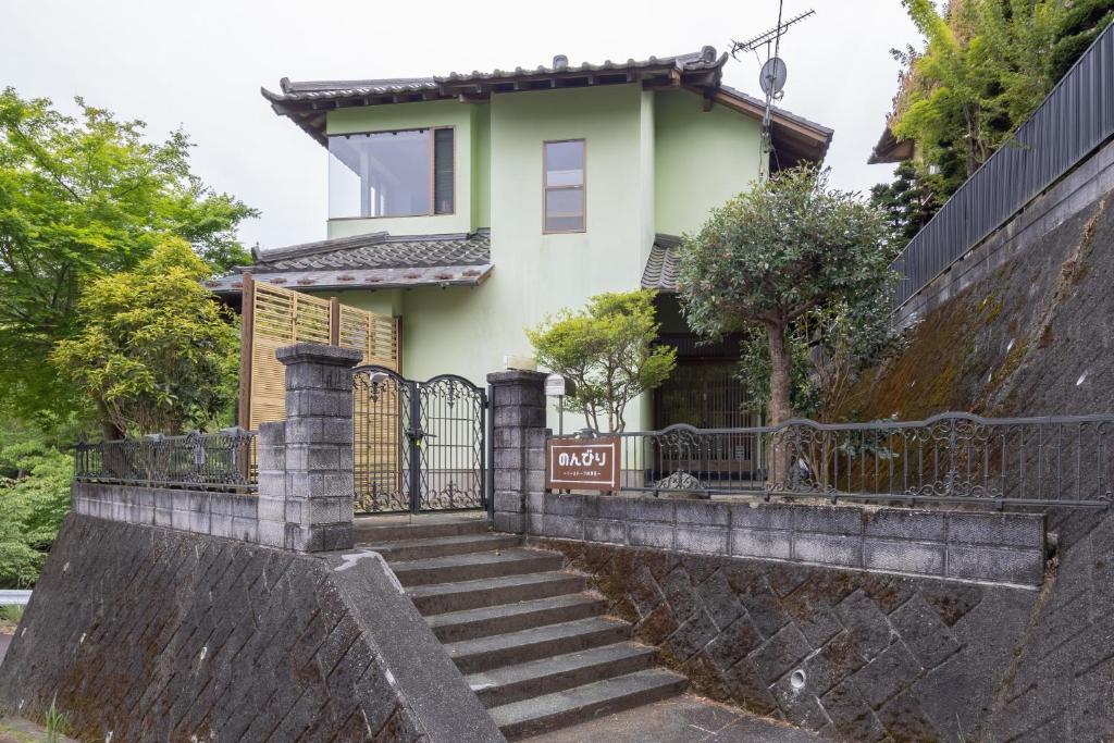 a house with a gate and stairs at Hot spring inn Nonbiri -Ihatov Nakaizu- - Vacation STAY 51852v in Izu