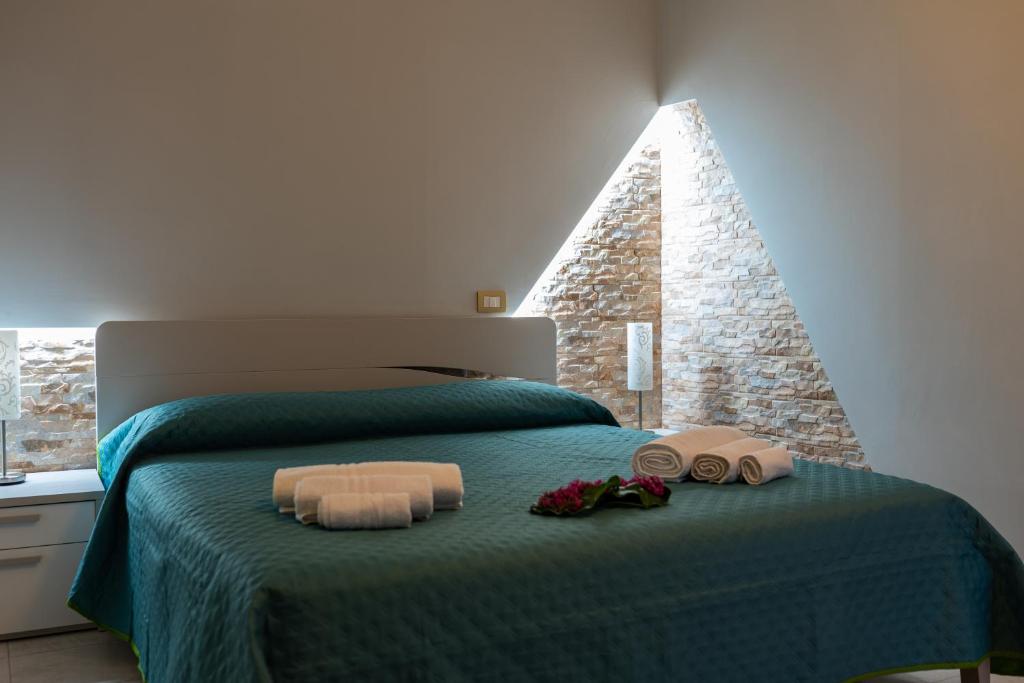 Postel nebo postele na pokoji v ubytování B&B al Vico Pepe