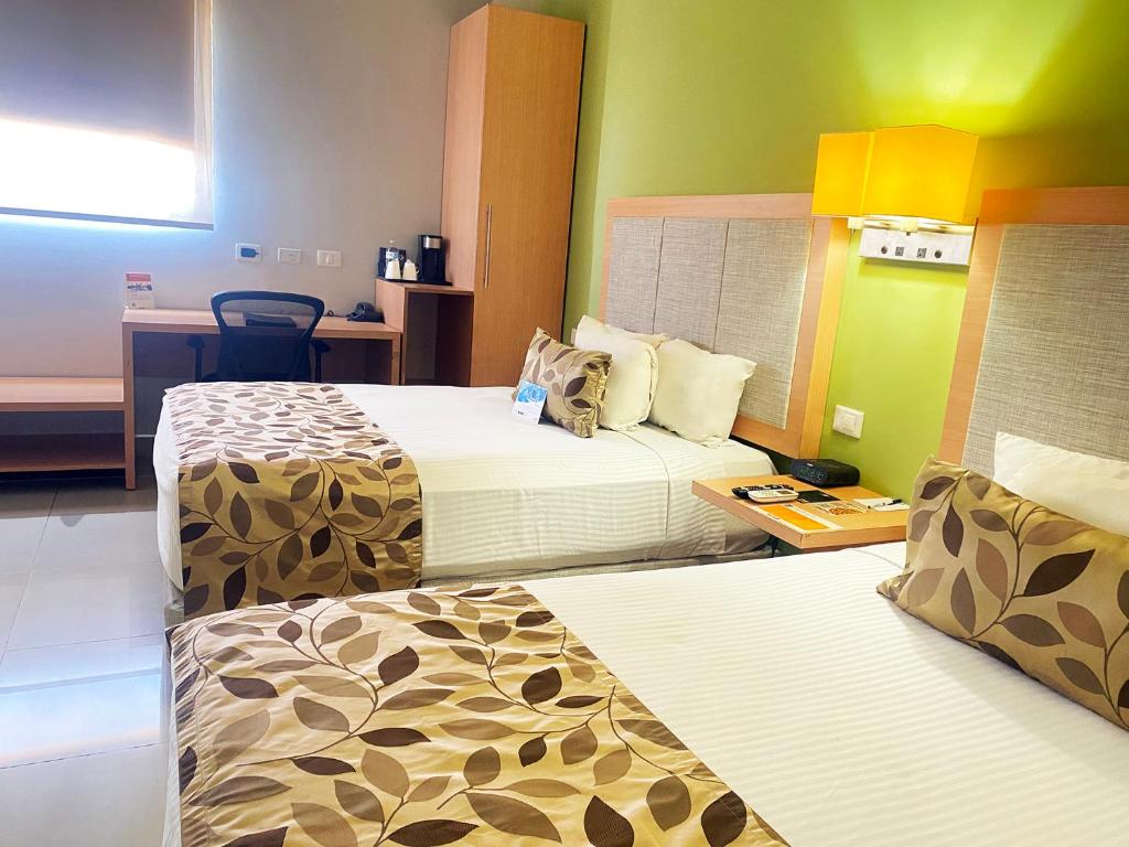 Postel nebo postele na pokoji v ubytování Sleep Inn Culiacan