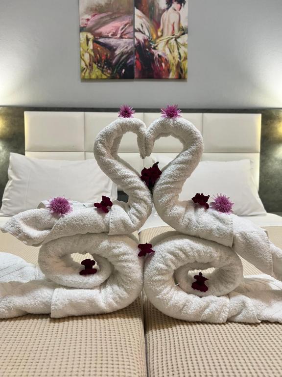 Postel nebo postele na pokoji v ubytování Maria Hotel Sisi
