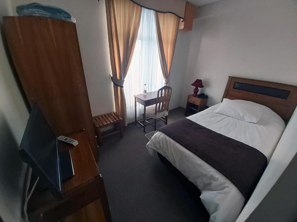 Postel nebo postele na pokoji v ubytování Hotel Esmeralda