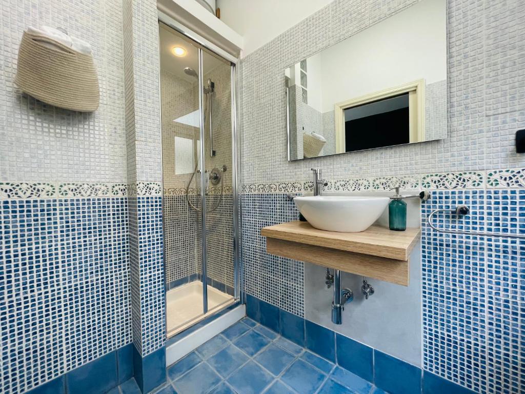 a bathroom with a sink and a shower at Le Dimore del Corso in Catania
