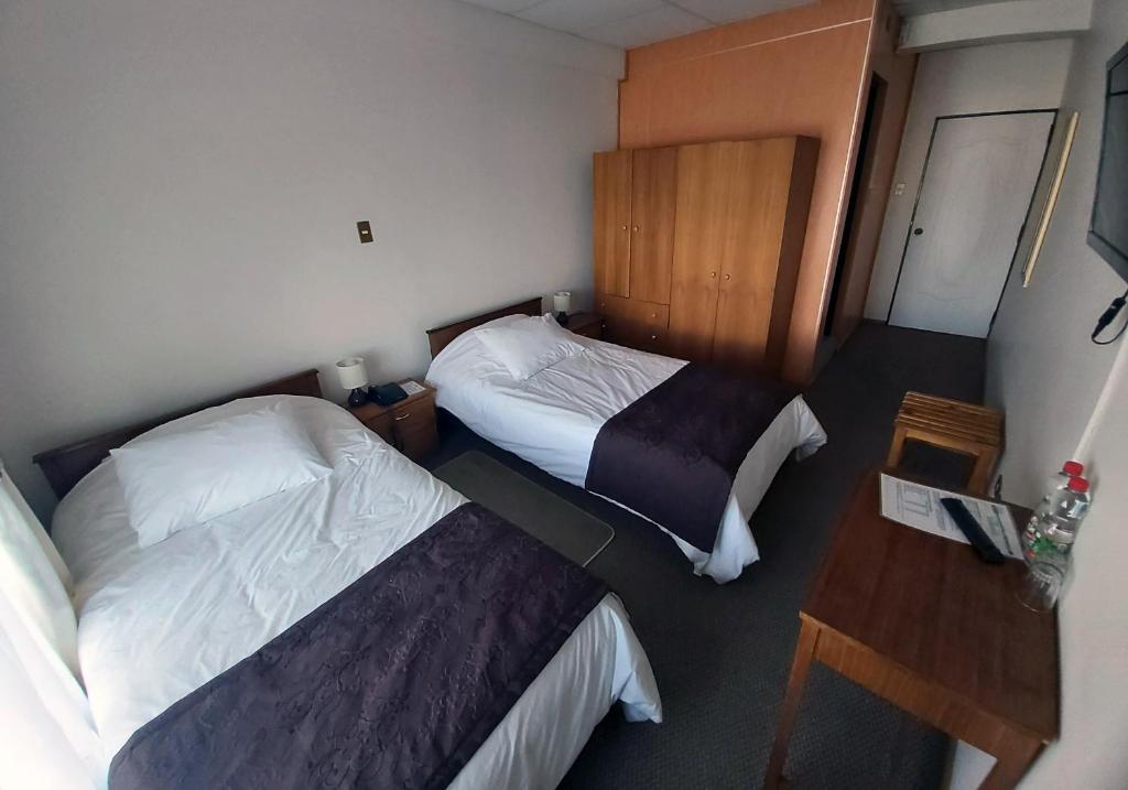 Postel nebo postele na pokoji v ubytování Hotel Esmeralda