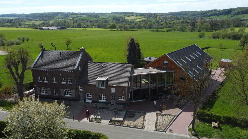 an aerial view of a large house in a field at Hof van Kleeberg in Mechelen