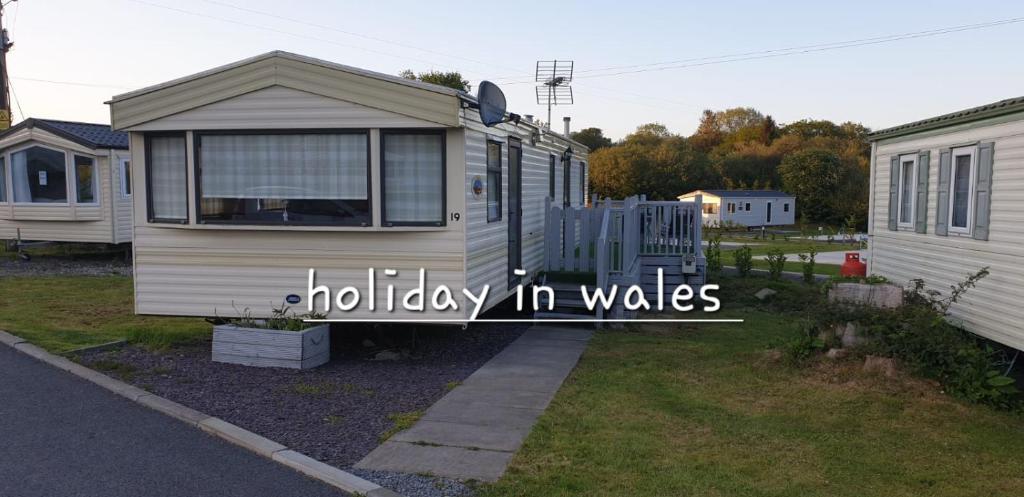 a holiday in wales written on the side of a trailer at Static 19 in Llandysul
