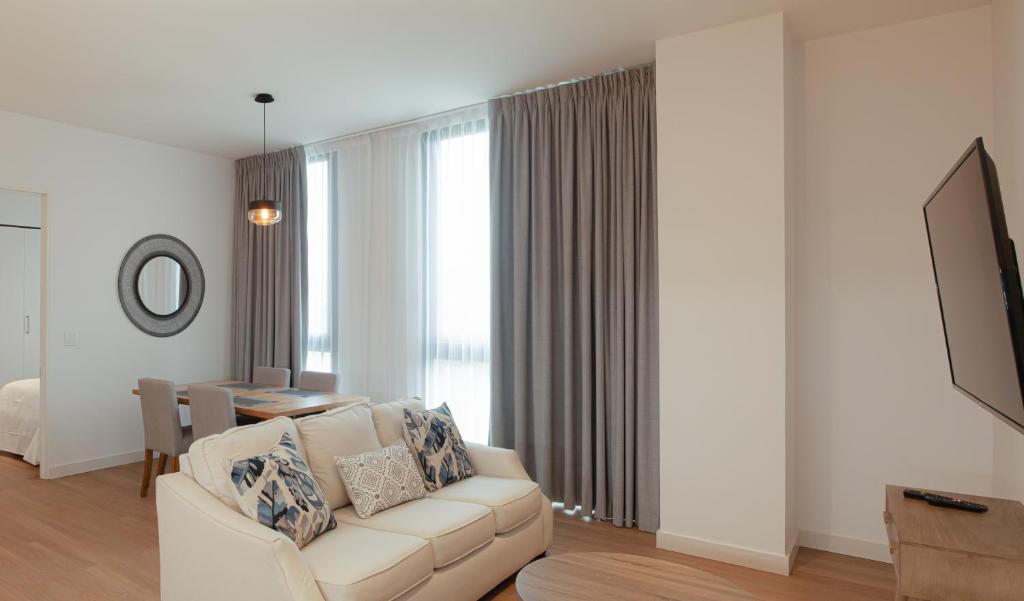 TV a/nebo společenská místnost v ubytování Residencias Cityzen cerca del Aeropuerto