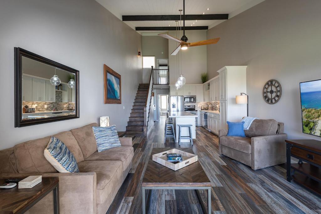 a living room with a couch and a table at Hale Kamaole in Wailea