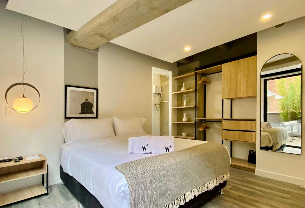 Cama o camas de una habitación en Picturesque 1BR in Chapinero