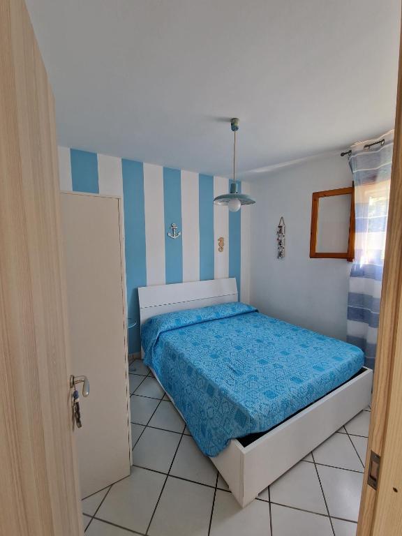 Postel nebo postele na pokoji v ubytování Casamarina Orchidea