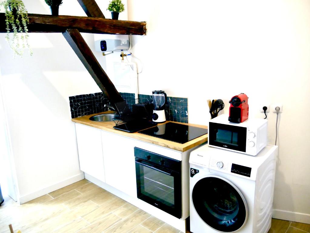 Een keuken of kitchenette bij Oasis Aqua