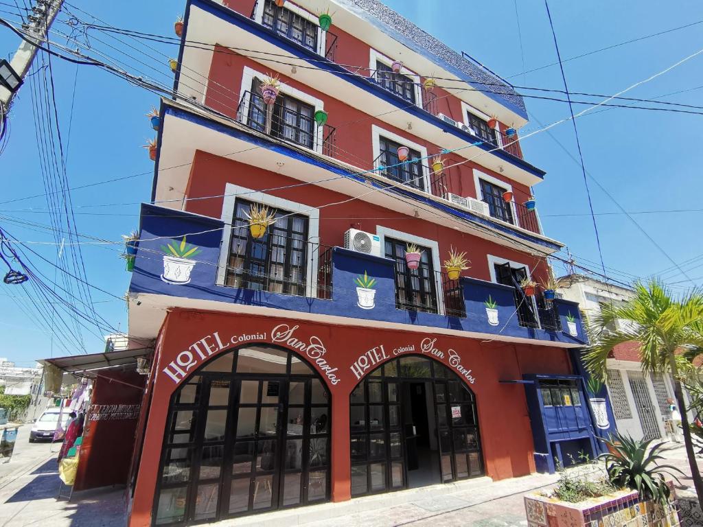 a building with a red and blue building at Hotel Colonial San Carlos in Cancún