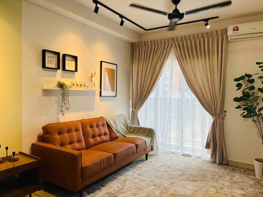 a living room with a couch and a large window at NEW Chic Cosy Sepang KLIA KLIA2 5-7 Pax in Sepang