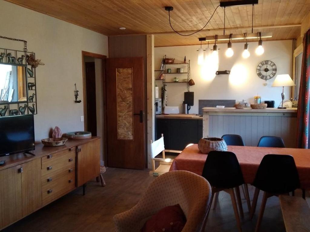 a living room with a dining room table and a kitchen at Appartement Crest-Voland, 2 pièces, 6 personnes - FR-1-733-52 in Crest-Voland