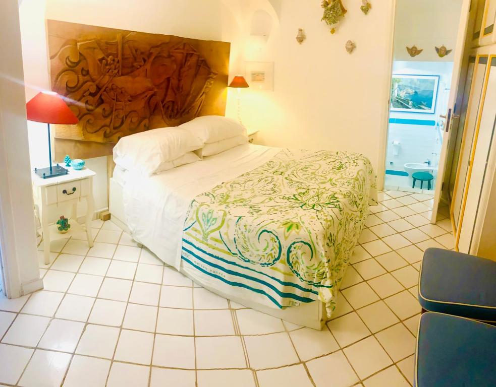 A bed or beds in a room at Scala Fenicia 14 by CapriRooms