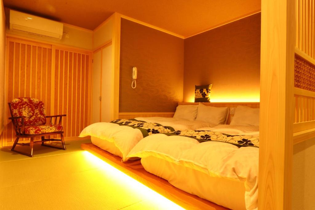 Letto o letti in una camera di Ryokan Tanabe 旅館 田邊