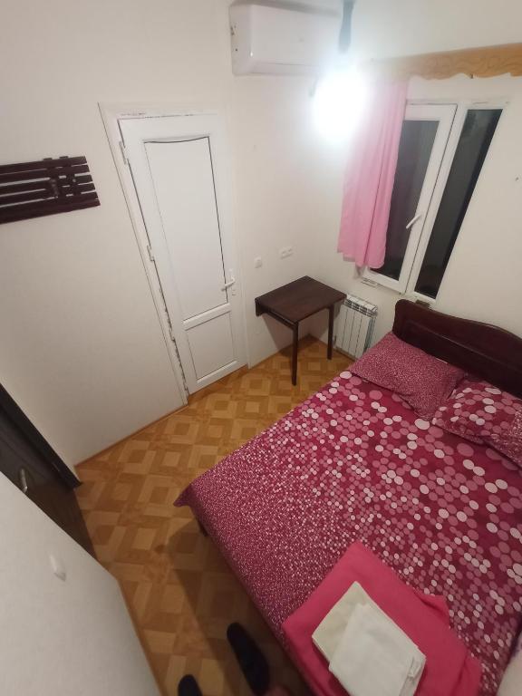 Postel nebo postele na pokoji v ubytování Hotel Kharabadze
