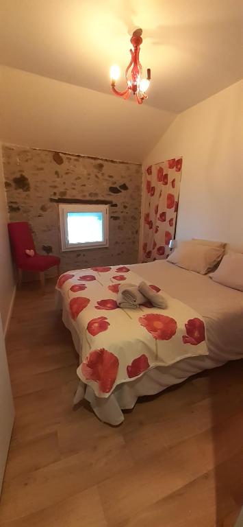 Postel nebo postele na pokoji v ubytování PAS à PAS CHAMBRE D'HOTES