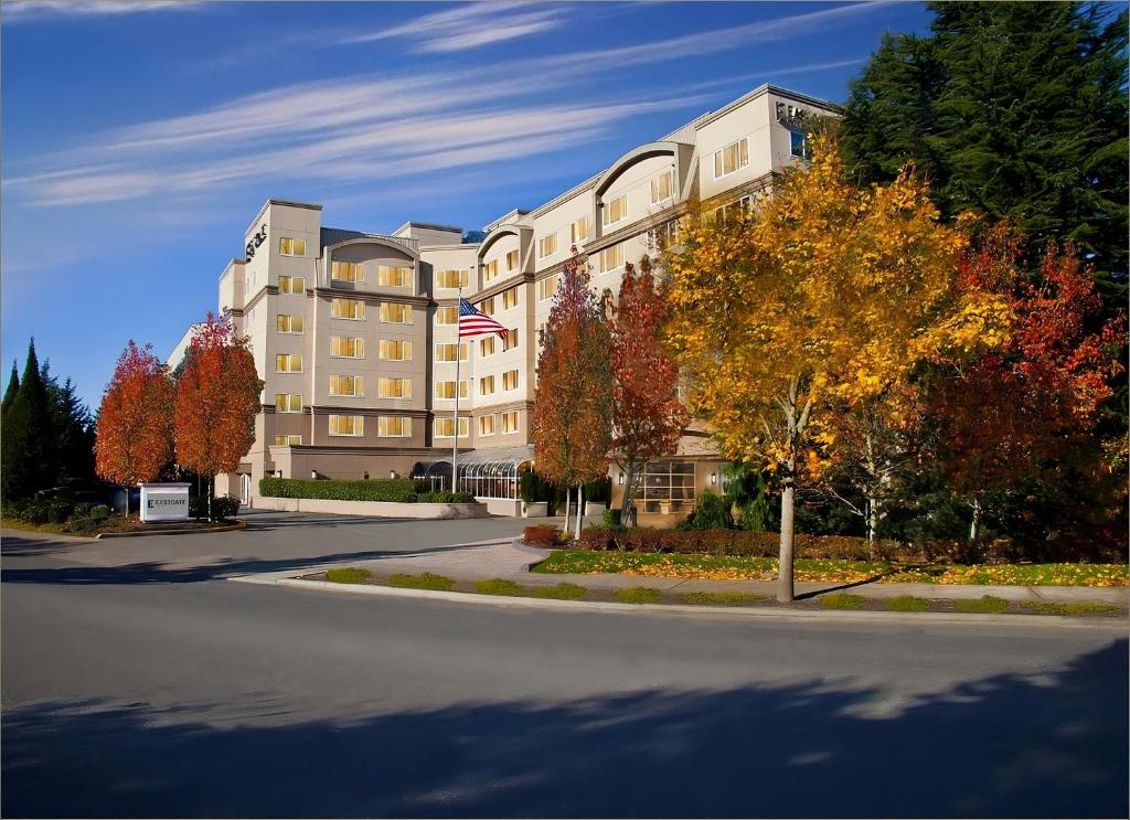 a building with an american flag in front of it at Eastgate Hotel - BW Signature Collection in Bellevue