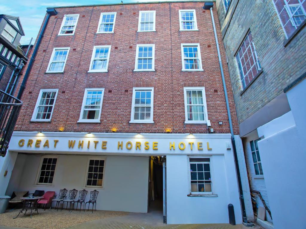 a red brick building with a white house hotel at Great White Horse Hotel in Ipswich