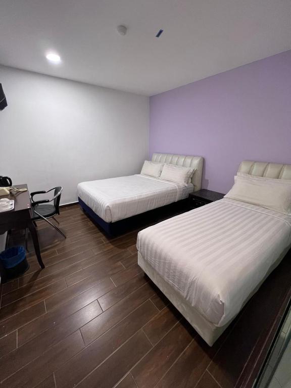 Postel nebo postele na pokoji v ubytování Elmark Hotel Johor