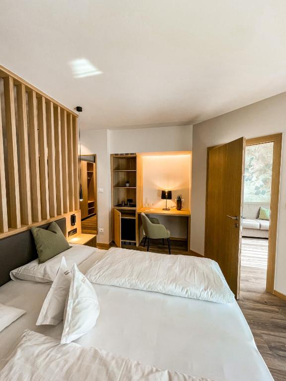 Postel nebo postele na pokoji v ubytování Hotel Theresia