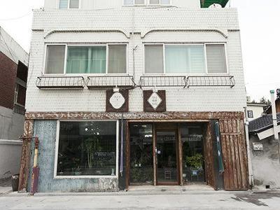 a building on the corner of a street at Danaharu Guesthouse in Jeonju