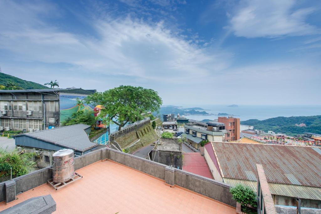 a view of a city from the roof of a building at H&amp; Jiufen The Dragon Inn in Jiufen