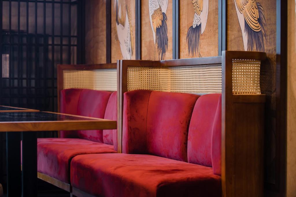 two red seats in a room with a table at H&amp; Jiufen The Dragon Inn in Jiufen