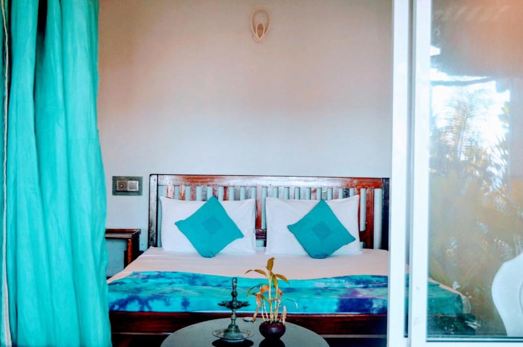 Llit o llits en una habitació de Wallama Villa