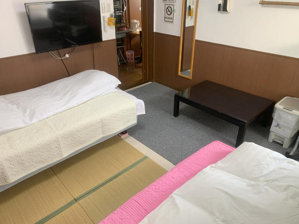 Postel nebo postele na pokoji v ubytování Oyama Guesthouse Kyoto