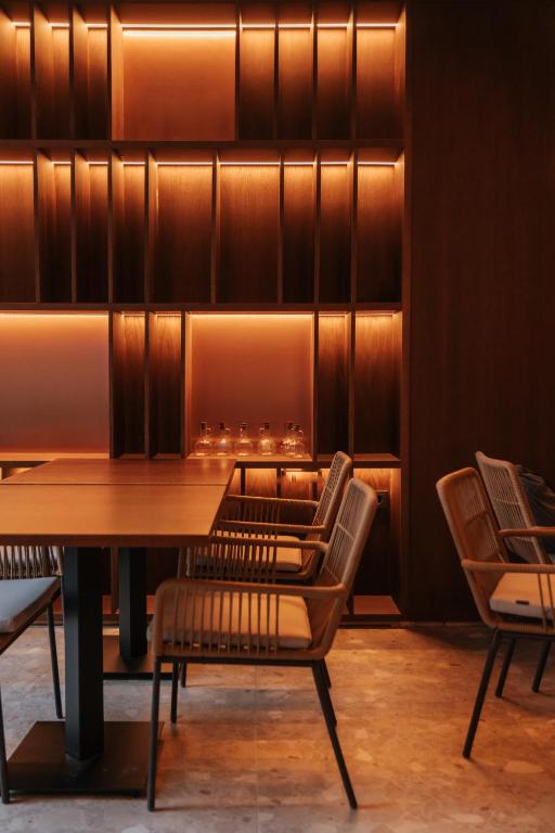 a dining room with a table and chairs at Boutique Hotel OLOM - Only Adults recommended in Cádiz