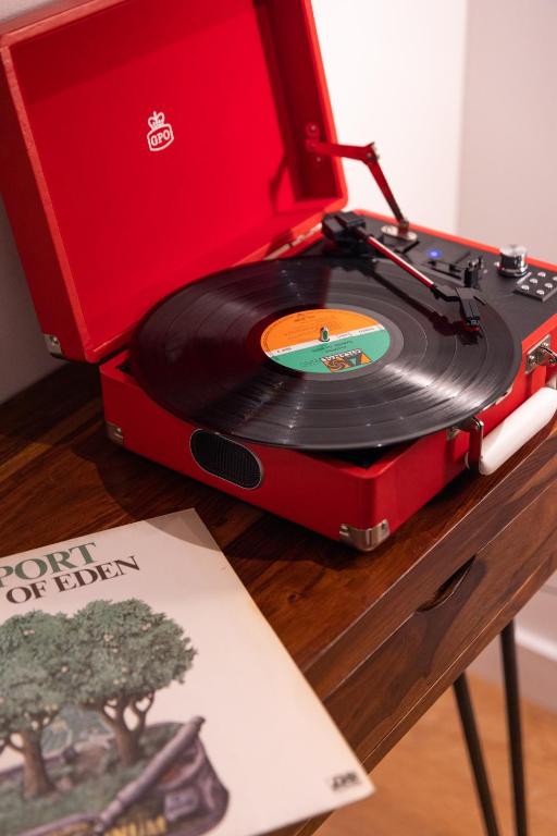 a record player sitting on top of a table at Boutique Hotel OLOM - Only Adults recommended in Cádiz