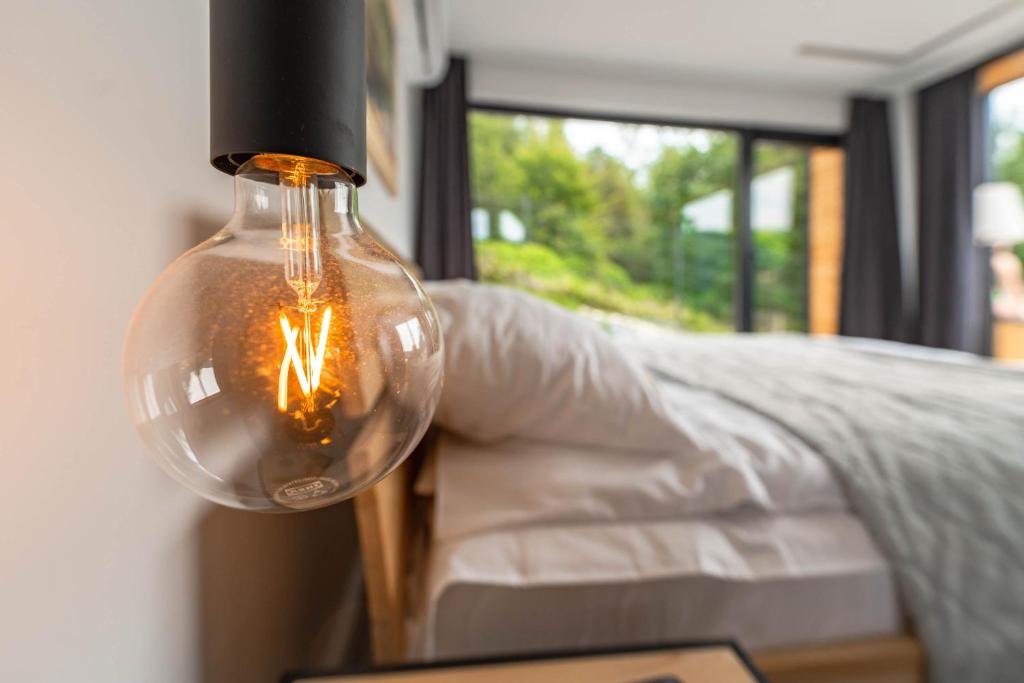 Posteľ alebo postele v izbe v ubytovaní Osada Mountain Villas Szczyrk - domki z balią i sauną - piękny widok na góry - Dream Apart