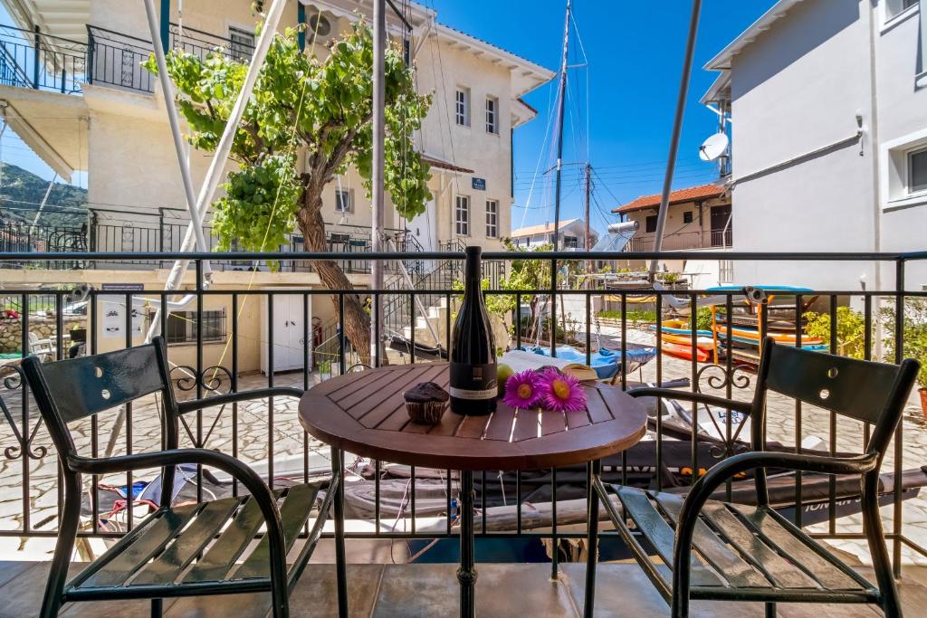 a table and chairs on the balcony of a building at Nikiana Club - Studio 6 in Nikiana