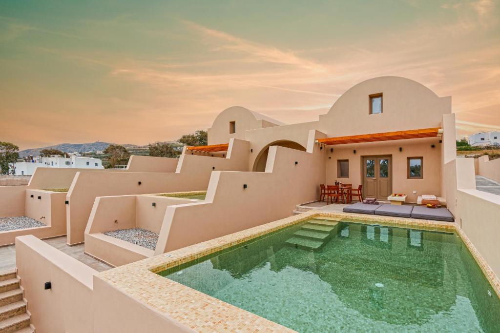 an image of a villa with a swimming pool at Living Moments in Fira