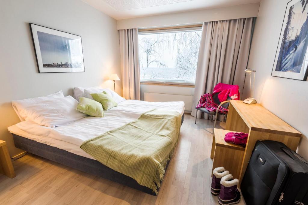 Postel nebo postele na pokoji v ubytování Ski-Inn Hotel Pyhätunturi