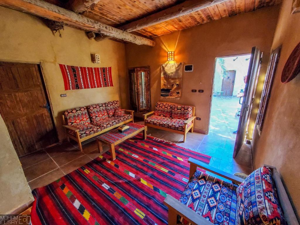 Postel nebo postele na pokoji v ubytování Paloma Lodge