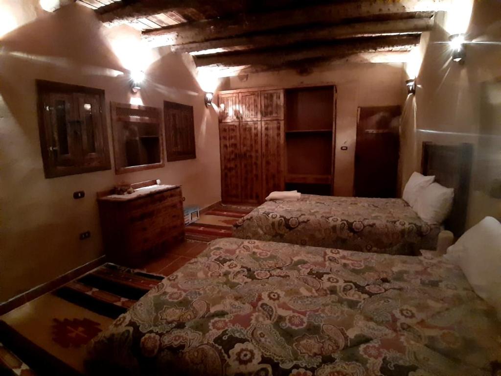 Postel nebo postele na pokoji v ubytování Paloma Lodge