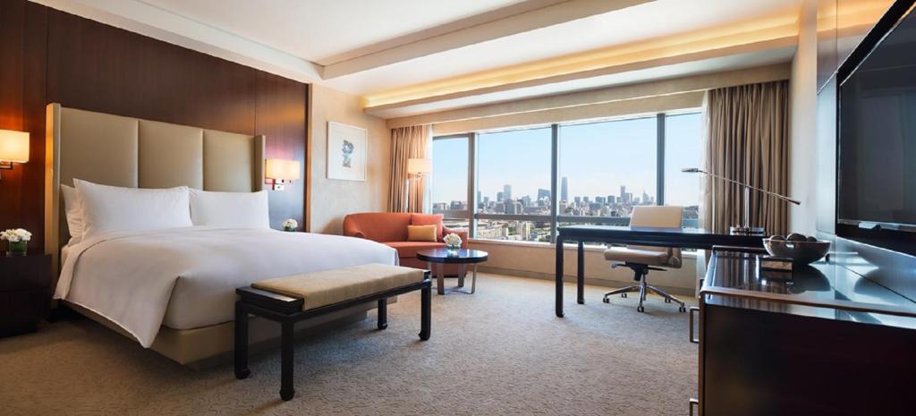 Postel nebo postele na pokoji v ubytování JW Marriott Hotel Beijing Central