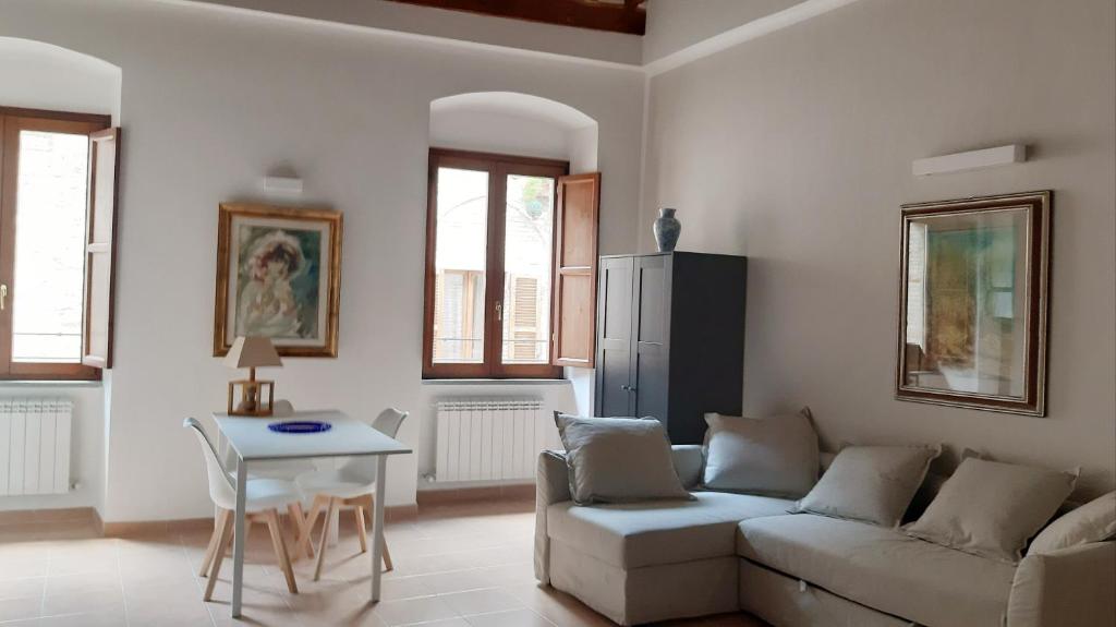 a living room with a couch and a table at Civico in Gubbio