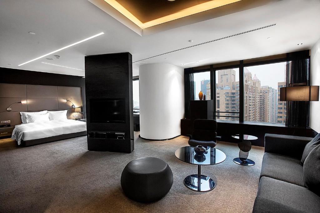 Postel nebo postele na pokoji v ubytování Shenzhen O Hotel