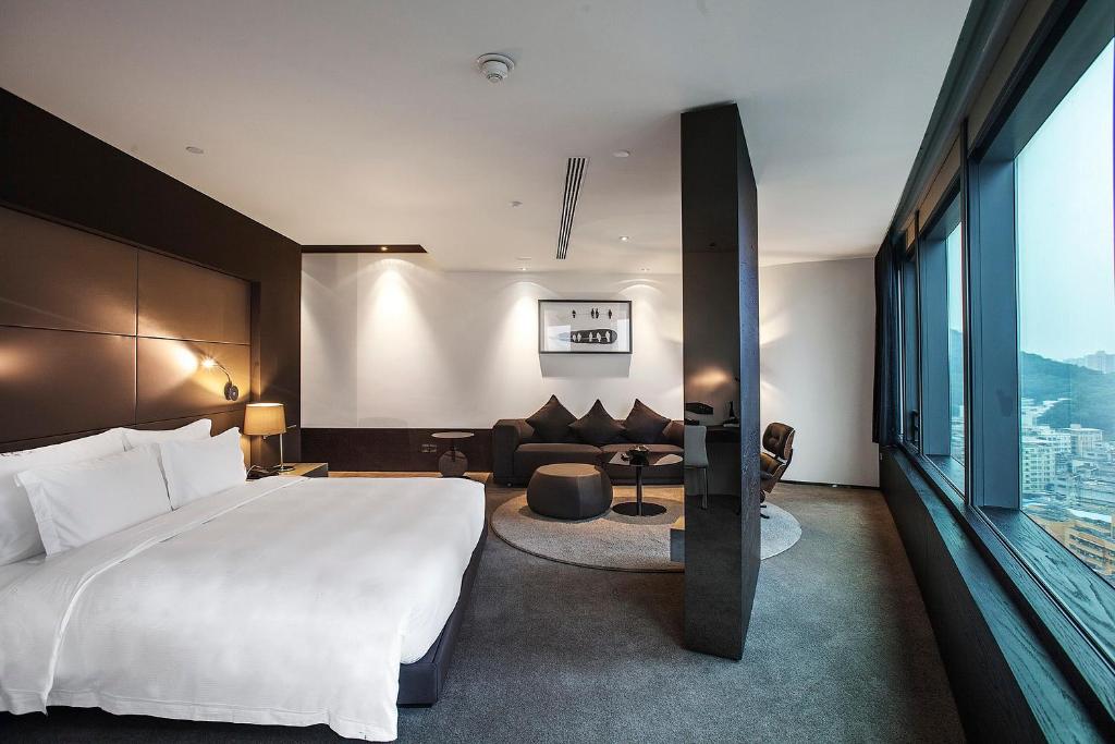 Postel nebo postele na pokoji v ubytování Shenzhen O Hotel