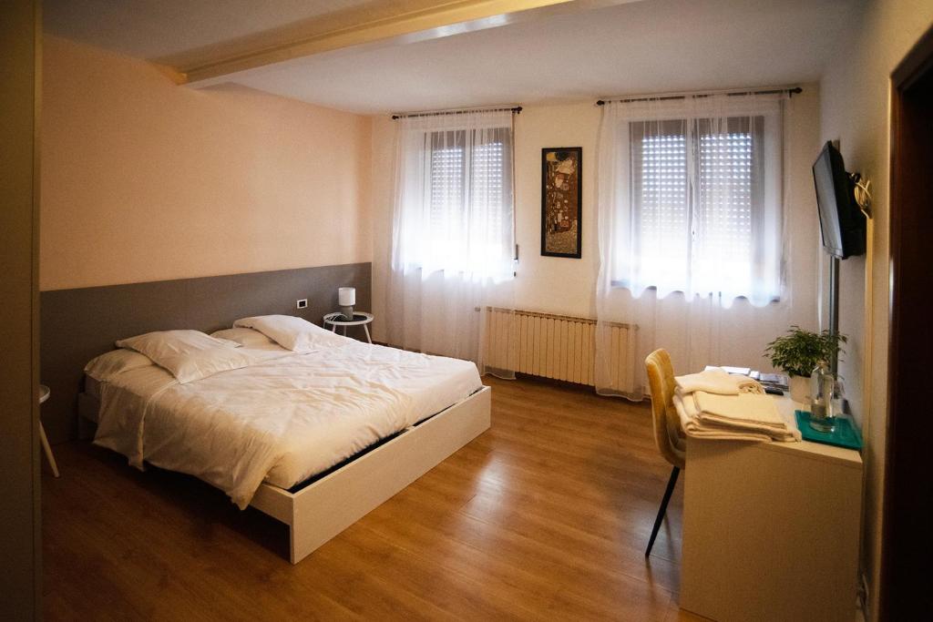 Postel nebo postele na pokoji v ubytování Albergo Alla Cesa
