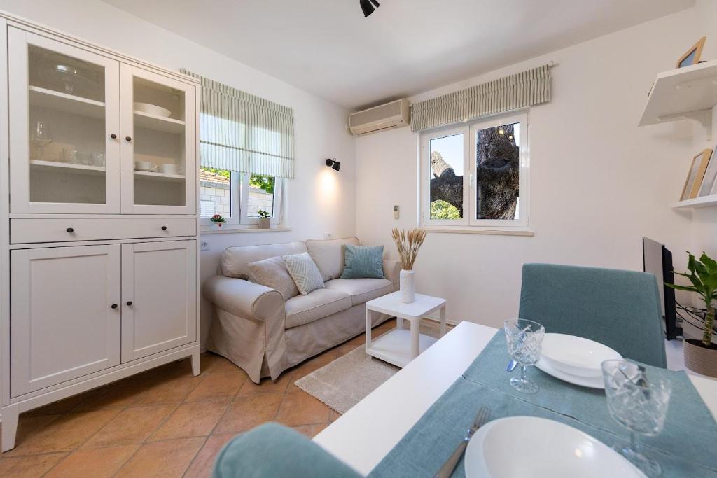 a living room with a couch and a table at Apartment Judita in Dubrovnik