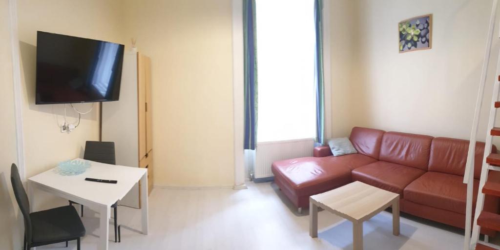 Televízia a/alebo spoločenská miestnosť v ubytovaní Melisa Apartment
