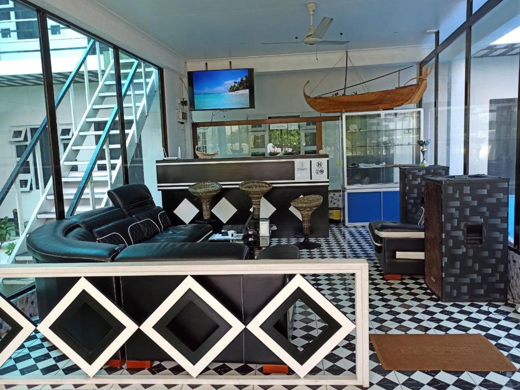 TV a/nebo společenská místnost v ubytování Dhonfulhafi Beach View