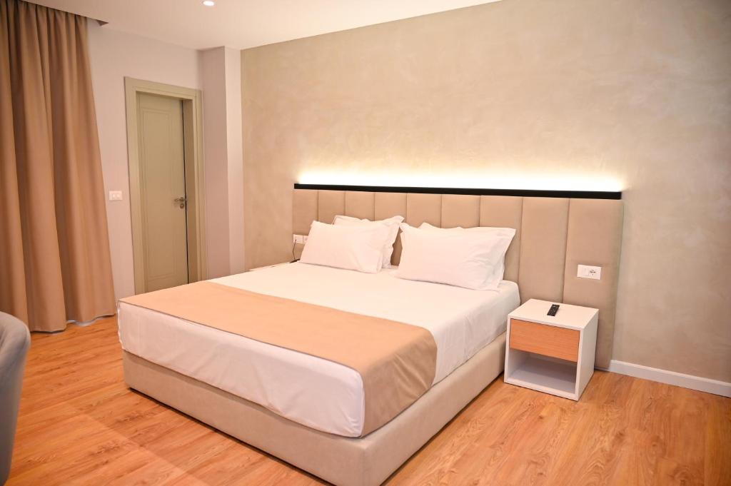 Uma cama ou camas num quarto em Hotel Zanzi