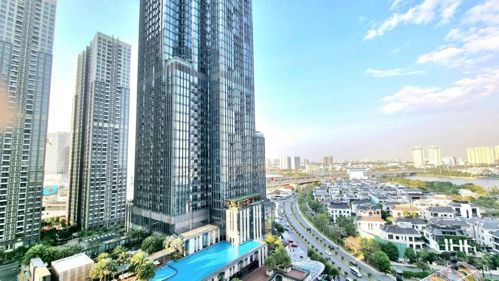 an aerial view of a city with tall buildings at 123 Apartment in Vinhomes Central Park - Landmark 81 in Ho Chi Minh City