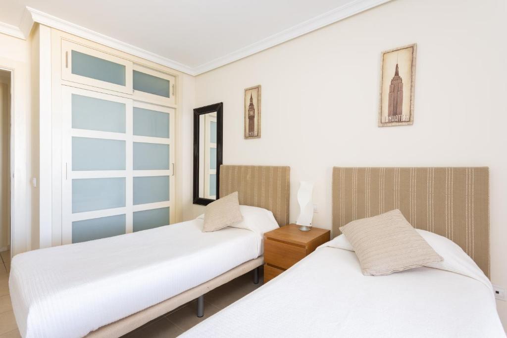 Postel nebo postele na pokoji v ubytování Home2Book Stunning Sea Views & Pool Los Gigantes